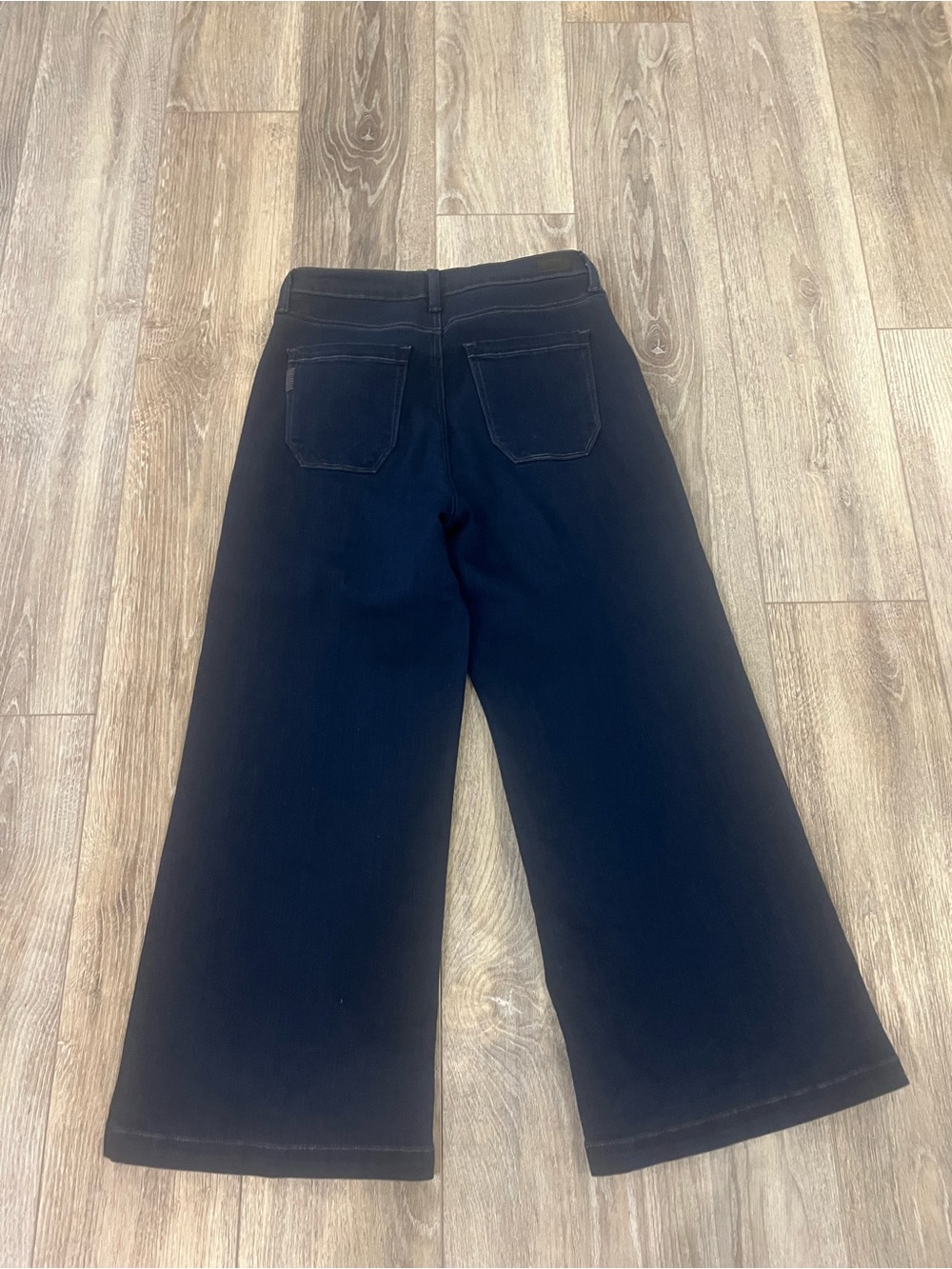 PAIGE Genesee Wide-Leg Crop Jeans in dark denim.